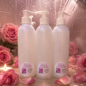 Duschseife Rose (Flüssigseife) in eine weißer Rundflasche 250ml mit Dossierspender, stehend in der Dusche